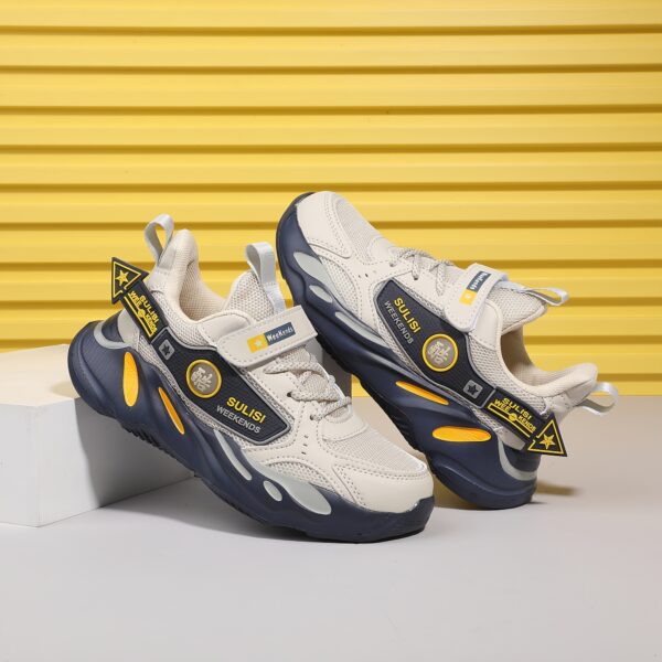Stylish striped mesh youth sneakers, perfect for active kids. Breathable and comfortable design in a trendy color scheme.