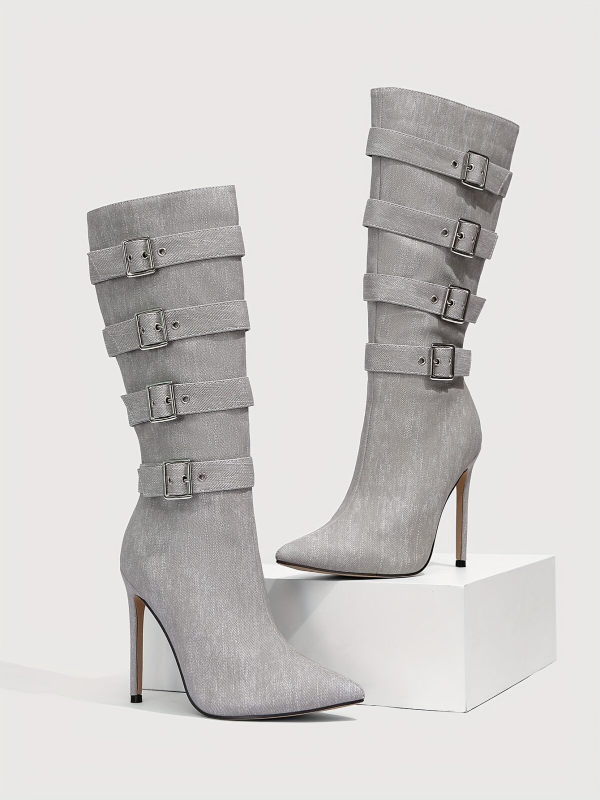 Newness Ascension Stiletto Buckle Boots Elevate your look with these stunning stiletto boots featuring a chic buckle detail