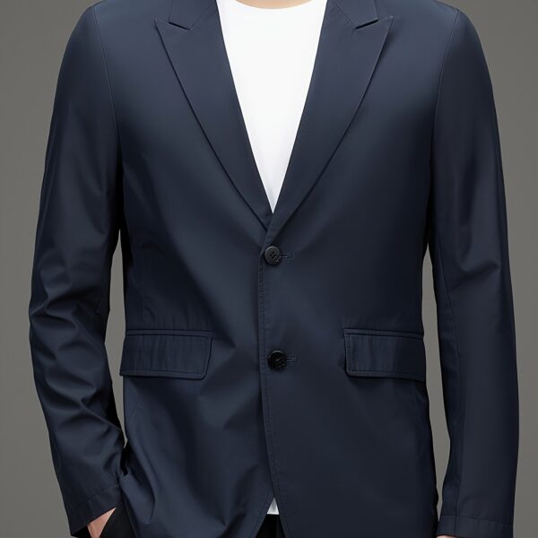 Newness Metropolitan Men's Casual Suit Jacket in versatile navy blue, modeled on a man striding confidently through a city street. The jacket is shown to highlight its sophisticated style and comfortable fit, perfect for spring or autumn.
