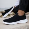 Newness Urban Trek Mens Slip On Sneakers in stylish minimalist design showcasing breathable comfort and effortless style