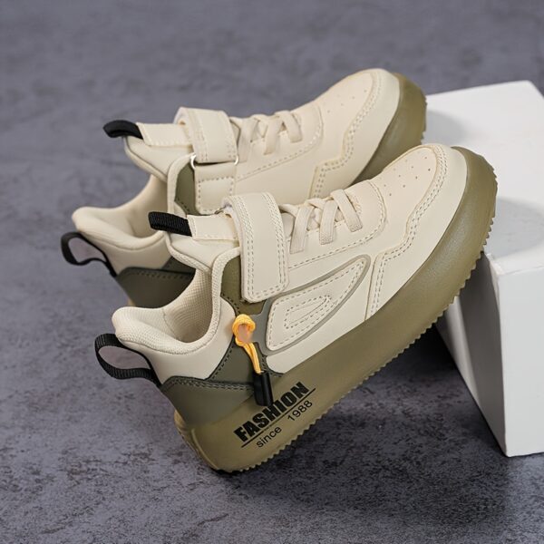 Stylish boy's retro sneakers in white with colorful tassels, perfect for everyday wear.