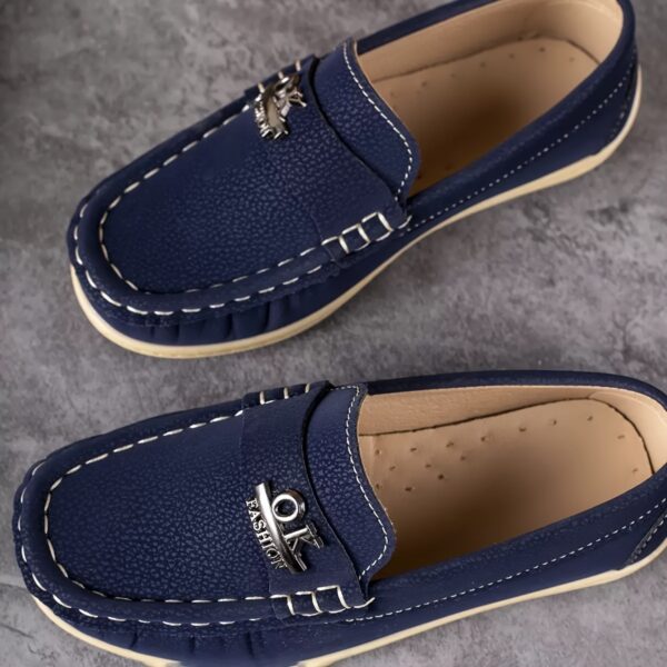 Stylish and comfortable Newness Classic Boys' Loafers, perfect for any occasion. A close-up shot showcasing the loafers' design and quality.