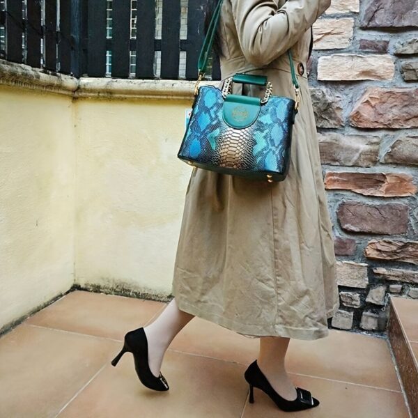 Emerald Envy Snakeskin Crossbody Bag by Newness. A chic, modern, and luxuriously designed crossbody bag in emerald green snakeskin.