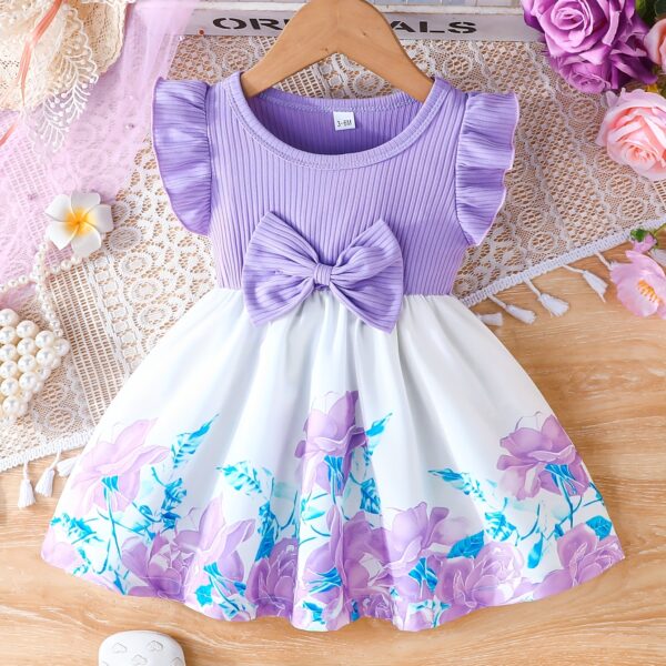 A little girl wearing a charming summer floral print dress.