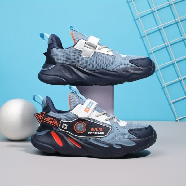 Stylish striped mesh youth sneakers, perfect for active kids. Breathable and comfortable design in a trendy color scheme.
