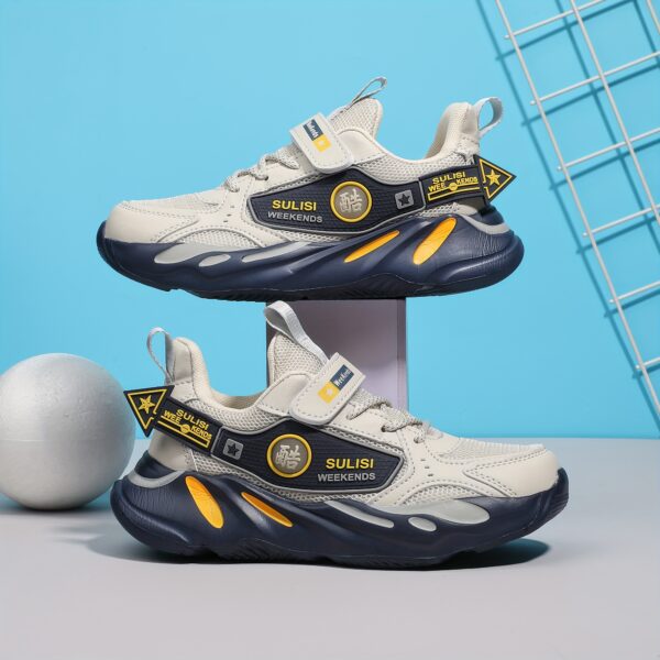 Stylish striped mesh youth sneakers, perfect for active kids. Breathable and comfortable design in a trendy color scheme.