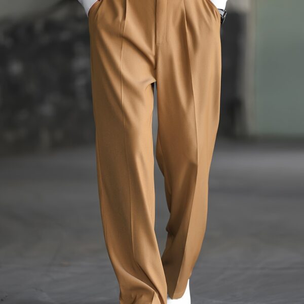 Model wearing Newness' Cairo Men's Wide-Leg Trousers, a sophisticated and modern wide-leg trouser in a versatile neutral color.