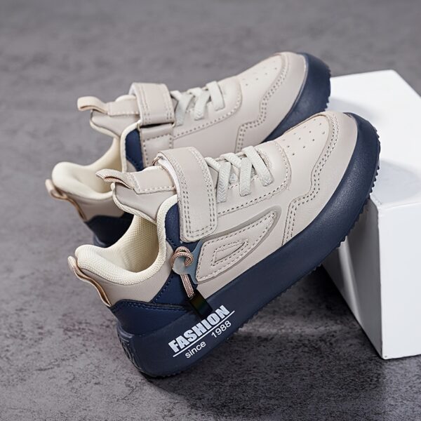 Stylish boy's retro sneakers in white with colorful tassels, perfect for everyday wear.