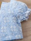 Adorable baby girl wearing a Summer Bloom floral outfit perfect for summer The outfit features a delightful floral pattern