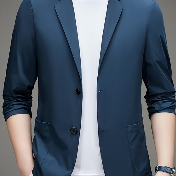 A man wearing the Newness Lightweight Breeze Men's Summer Blazer, looking effortlessly stylish in a summer setting.