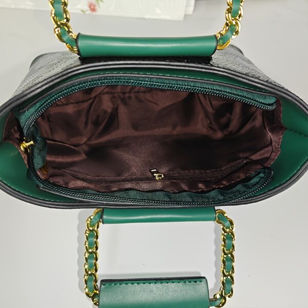 Emerald Envy Snakeskin Crossbody Bag by Newness. A chic, modern, and luxuriously designed crossbody bag in emerald green snakeskin.
