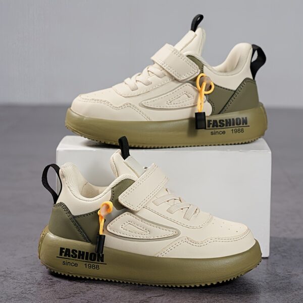 Stylish boy's retro sneakers in white with colorful tassels, perfect for everyday wear.