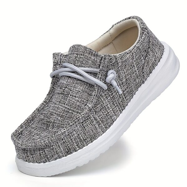 Stylish Newness Striped Canvas Kids' Slip-Ons in classic navy and white stripes. Lightweight and breathable, perfect for kids' everyday wear.