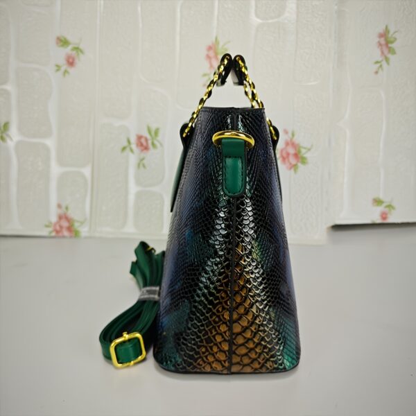 Emerald Envy Snakeskin Crossbody Bag by Newness. A chic, modern, and luxuriously designed crossbody bag in emerald green snakeskin.