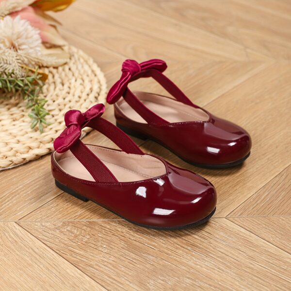 Adorable girls' Mary Jane shoes in pink with a darling bow detail, perfect for everyday wear.