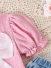 Adorable toddler girl in a stylish summer outfit featuring a cute bow Shop Newness for more childrens fashion