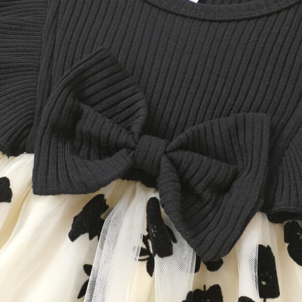 Petite Fleur: A charming girl in a floral mesh dress, twirling happily.