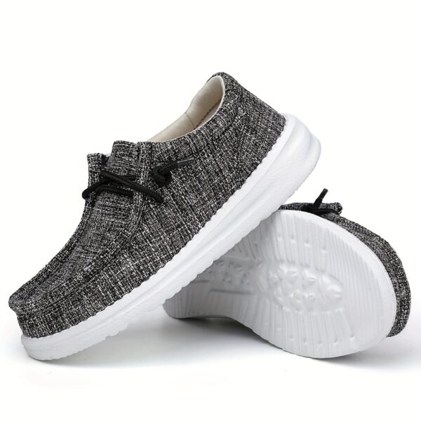 Stylish Newness Striped Canvas Kids' Slip-Ons in classic navy and white stripes. Lightweight and breathable, perfect for kids' everyday wear.