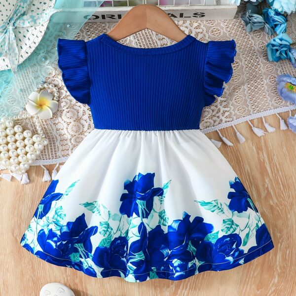 A little girl wearing a charming summer floral print dress.