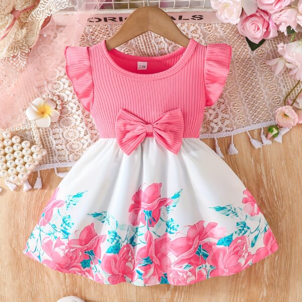 A little girl wearing a charming summer floral print dress.