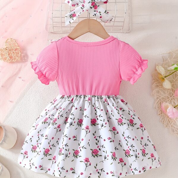 Adorable baby girl wearing a lightweight Summer Meadow floral print dress, perfect for casual summer outings.