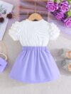 Adorable Pastel Dream Girls Summer Set featuring a pastel colored top and bottom perfect for summer The outfit is shown on a young girl highlighting its comfortable and stylish design