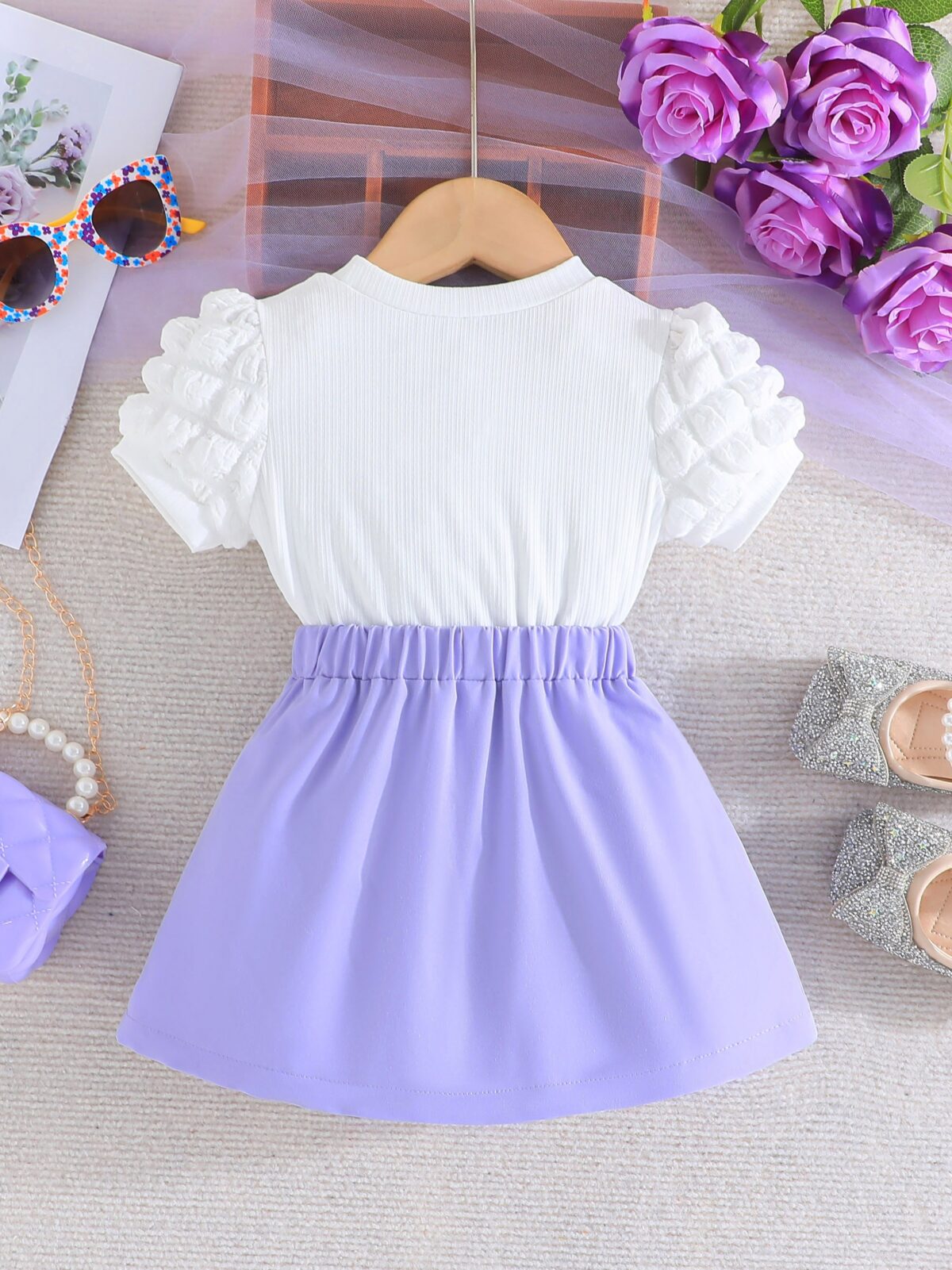 Adorable Pastel Dream Girls Summer Set featuring a pastel colored top and bottom perfect for summer The outfit is shown on a young girl highlighting its comfortable and stylish design