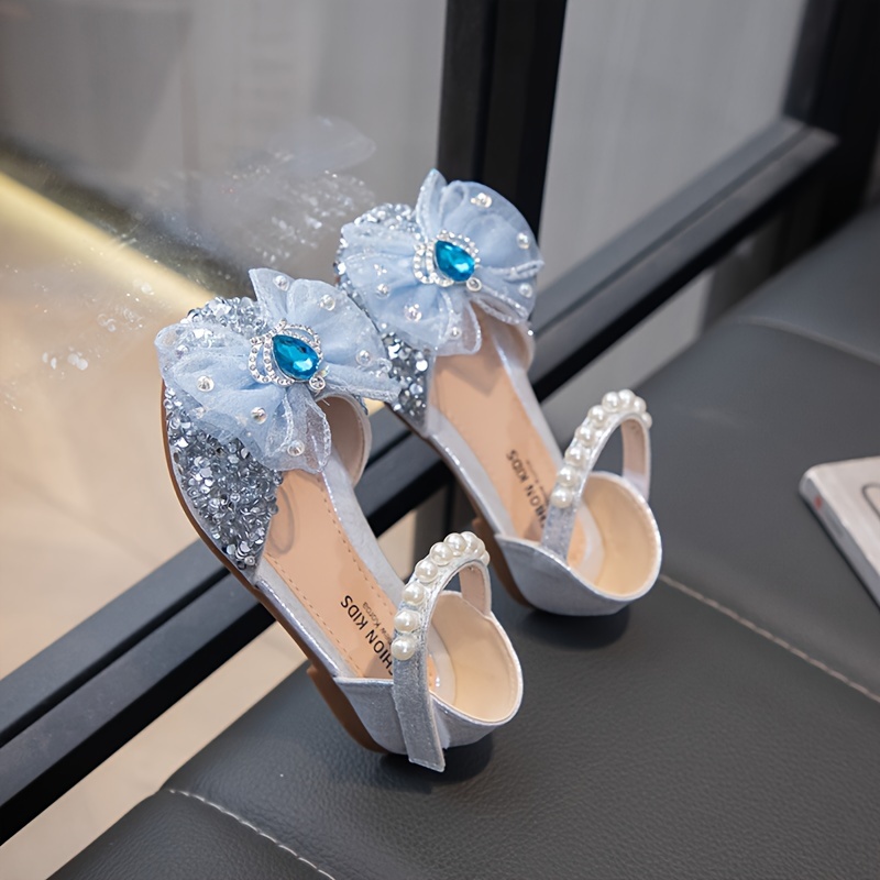 Close-up of Newness's Enchanted Garden Rhinestone Princess Shoes, showcasing sparkling rhinestones and delicate design. Perfect for a young girl.