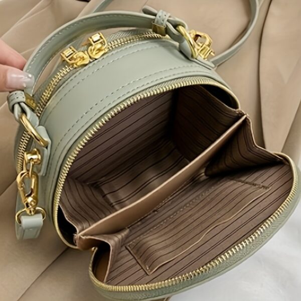 Vienna Embroidered Crossbody Bag in chic faux leather with golden hardware and unique embroidered design.