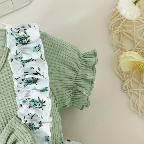Adorable baby girl wearing a lightweight Summer Meadow floral print dress, perfect for casual summer outings.