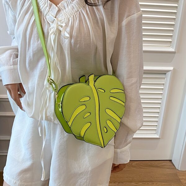 Newness Tropical Escape Leaf Crossbody Bag: A stylish and unique crossbody bag perfect for everyday use or outdoor adventures. Features a leaf-shaped design and adjustable strap.