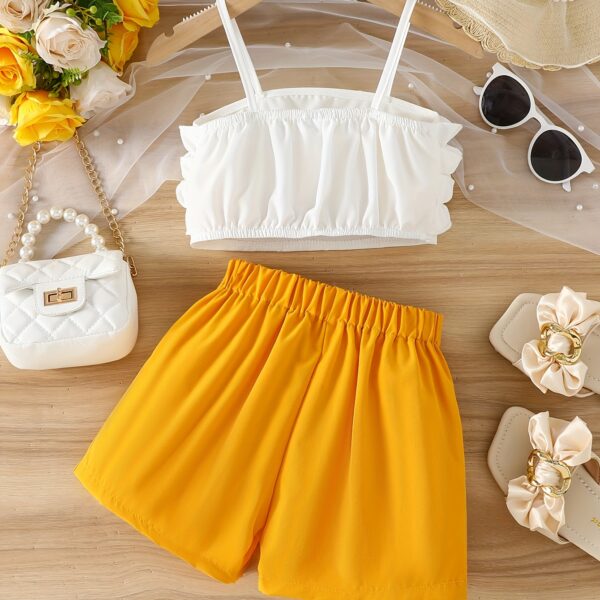 Adorable Summer Bloom Girls Shorts Set in a cheerful floral print, perfect for sunny summer days. The set includes a top and shorts.