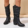 Newness Sunset Rider Ruched Cowboy Boots Brown leather cowboy boots with ruched detailing shown from the side in a lifestyle shot