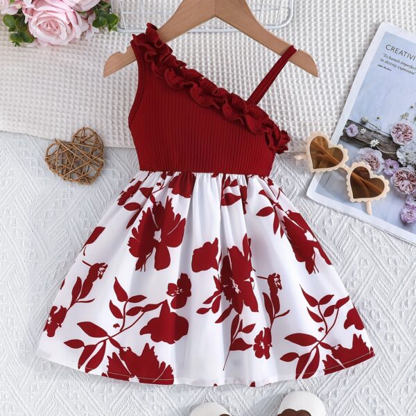 Adorable girl wearing a vibrant Summer Bloom floral print dress, perfect for summer vacations.