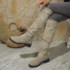 Newness Slouchy Knee High Boots in brown leather showcasing a chic and casual style perfect for winter The boots are slouchy and knee high highlighting their comfortable and fashionable design