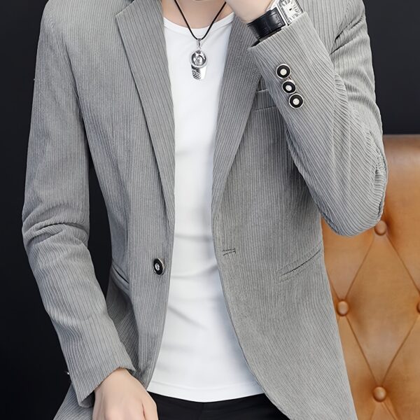 The Cairo Men's Corduroy Blazer in deep brown, a sophisticated and stylish men's blazer made from premium corduroy, perfect for any occasion. Model wearing the blazer.