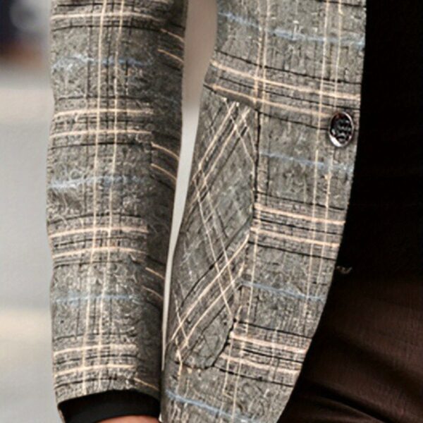 The Newness Metropolitan Checkered Blazer in spring style. A close-up showcases the premium fabric and refined, modern look.