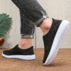Newness Breathable Mesh Slip On Sneakers in white showcasing the breathable mesh upper and easy slip on design Perfect for everyday wear