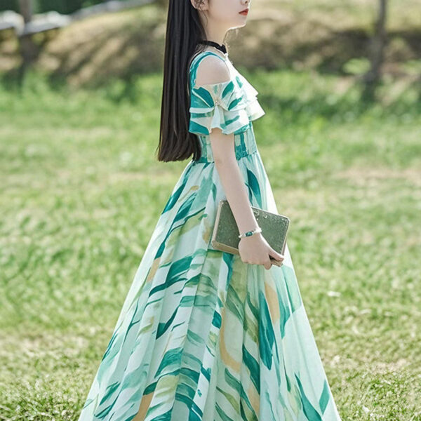 Adorable girl twirling in a flowy, elegant chiffon dress, perfect for summer. The dress is in a beautiful summer garden setting.