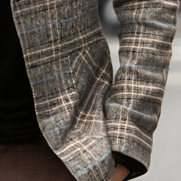 The Newness Metropolitan Checkered Blazer in spring style. A close-up showcases the premium fabric and refined, modern look.