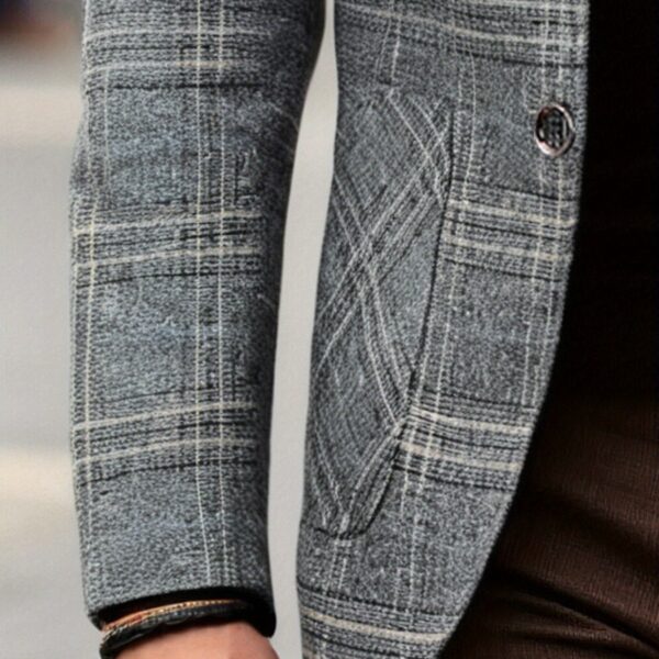 The Newness Metropolitan Checkered Blazer in spring style. A close-up showcases the premium fabric and refined, modern look.