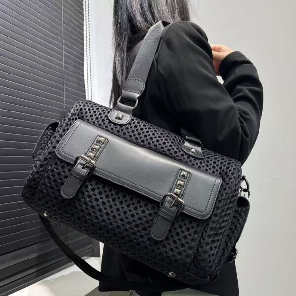 Newness Urban Edge Nylon Tote Bag, a stylish and versatile black nylon tote bag perfect for work, commuting, or evenings out. The bag features clean lines and a modern design.