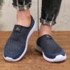 Newness Breathable Mesh Slip On Sneakers in white showcasing the breathable mesh upper and easy slip on design Perfect for everyday wear