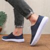 Newness Breathable Mesh Slip On Sneakers in white showcasing the breathable mesh upper and easy slip on design Perfect for everyday wear