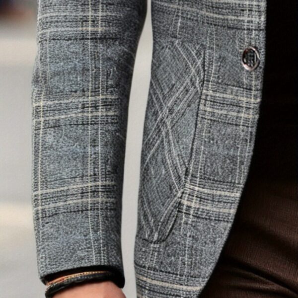 The Newness Metropolitan Checkered Blazer in spring style. A close-up showcases the premium fabric and refined, modern look.