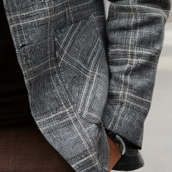 The Newness Metropolitan Checkered Blazer in spring style. A close-up showcases the premium fabric and refined, modern look.