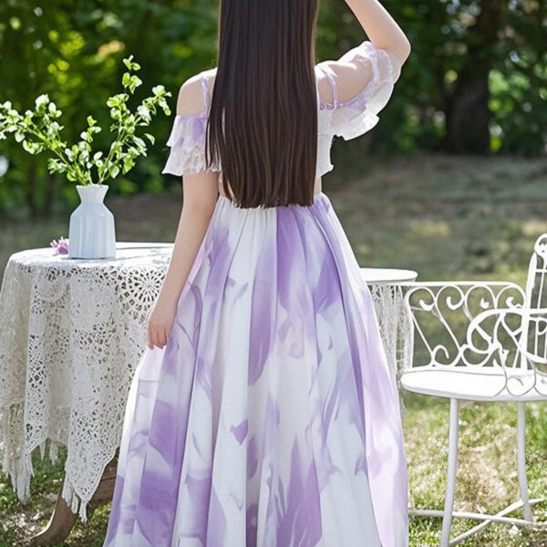Adorable girl twirling in a flowy, elegant chiffon dress, perfect for summer. The dress is in a beautiful summer garden setting.