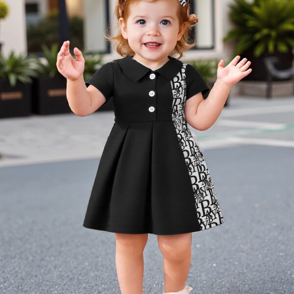Adorable baby girl in a stylish and comfortable summer dress from Newness, perfect for a playdate.