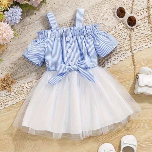 Adorable baby girl wearing a cute and playful summer stripe sundress, perfect for playtime.