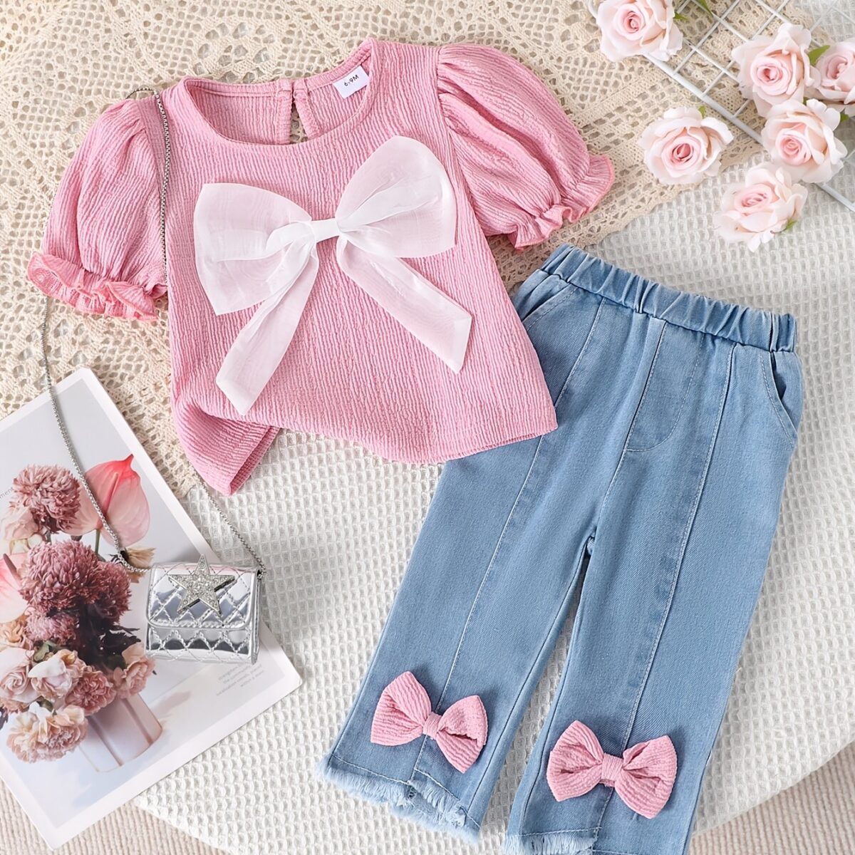 Adorable toddler girl in a stylish summer outfit featuring a cute bow Shop Newness for more childrens fashion